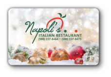 Napoli logo, red and gold ordiments laying in snow